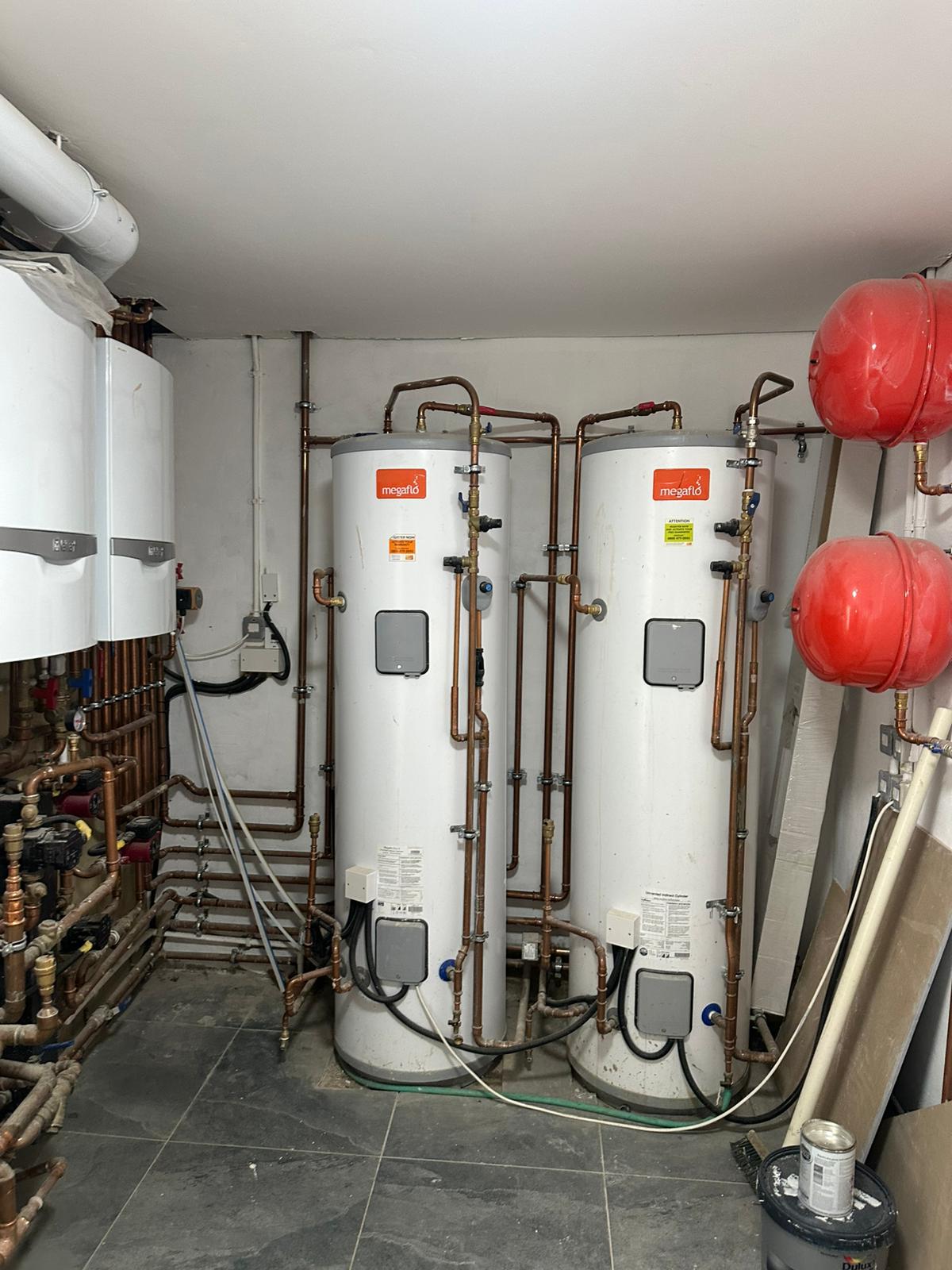Hot water cylinders and boilers in a plant room